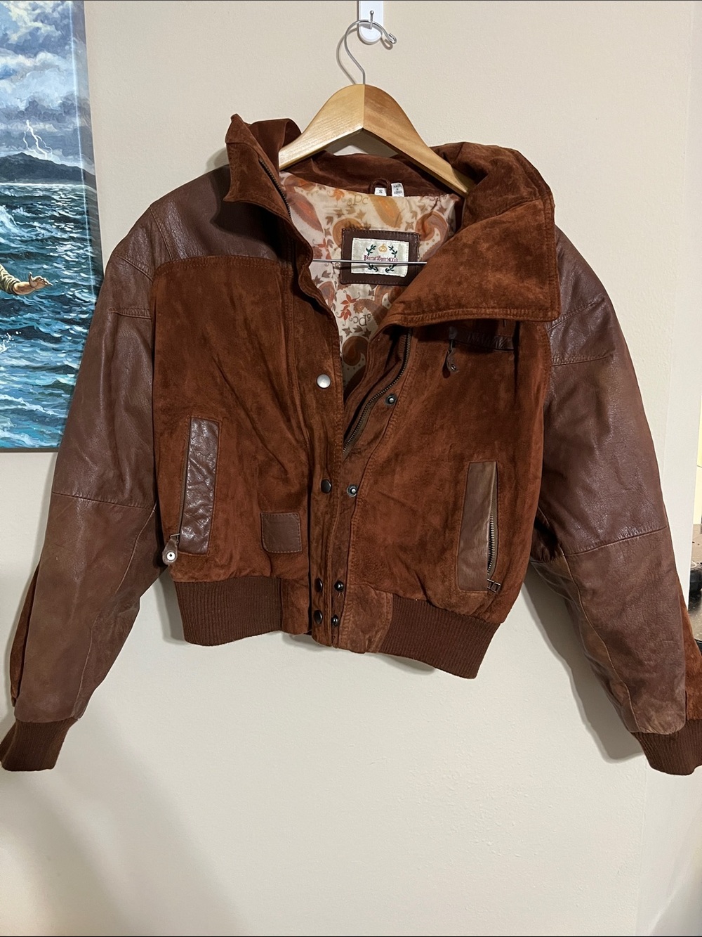vintage 1980s Paris Sport Club bomber-style leather jacket.